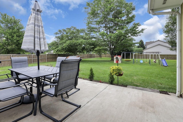 54 Barry Rd SW, Reynoldsburg, OH 43068 - fenced backyard featuring outdoor dining area, a playground, and a patio