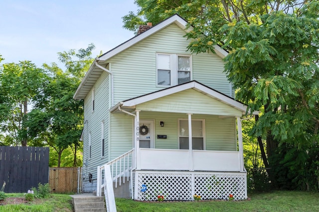 1008 E Whittier St, Columbus, OH 43206 - view of front of property with a porch and a chimney