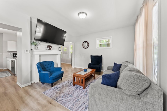1008 E Whittier St, Columbus, OH 43206 - living room featuring light wood-style floors and baseboards