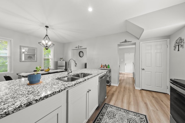 1008 E Whittier St, Columbus, OH 43206 - kitchen with stove, white cabinetry, stainless steel dishwasher, light wood-type flooring, and light stone counters