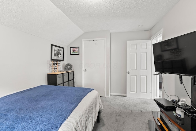 1008 E Whittier St, Columbus, OH 43206 - carpeted bedroom with a textured ceiling, lofted ceiling, and a closet