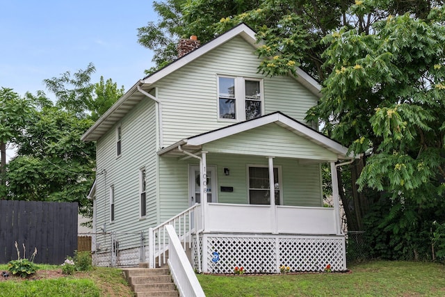 1008 E Whittier St, Columbus, OH 43206 - traditional style home with a porch and a chimney