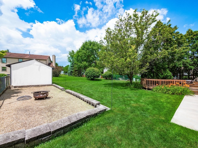 2883 Castlebrook Ave, Hilliard, OH 43026 - fenced backyard featuring a fire pit and a wooden deck