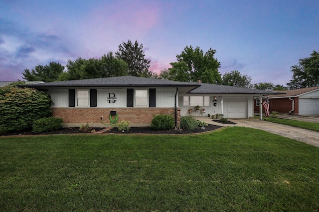 1418 Clemens Pl, Reynoldsburg, OH 43068 - single story home with brick siding, concrete driveway, an attached garage, and a lawn