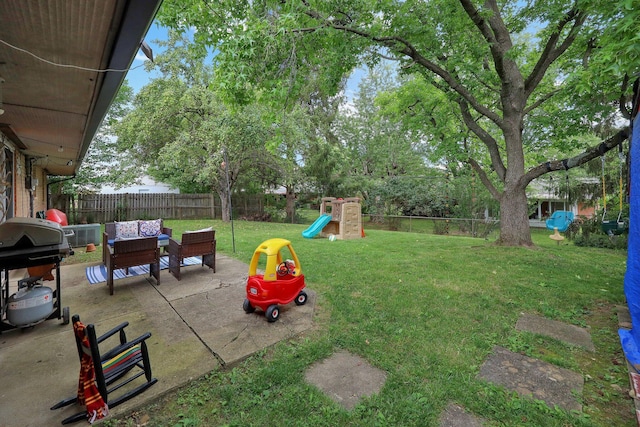 1418 Clemens Pl, Reynoldsburg, OH 43068 - fenced backyard with a patio area and a playground