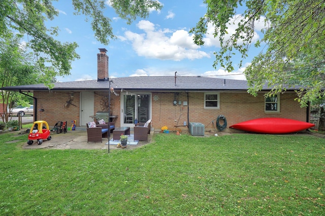 1418 Clemens Pl, Reynoldsburg, OH 43068 - back of property featuring a patio area, brick siding, a chimney, and an outdoor living space