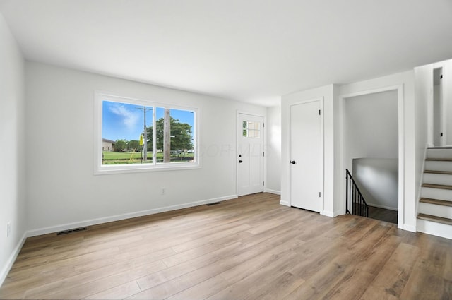 5244 Refugee Rd, Columbus, OH 43232 - unfurnished living room featuring light wood-style floors
