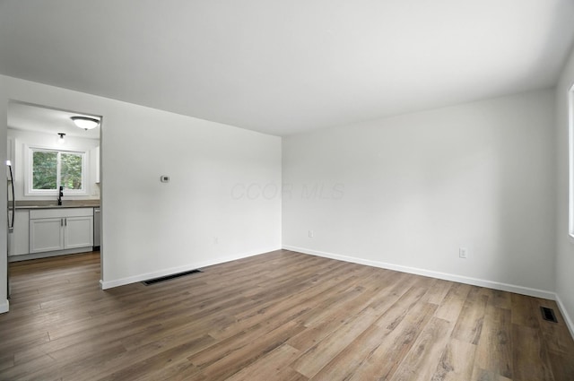 5244 Refugee Rd, Columbus, OH 43232 - spare room featuring wood finished floors and baseboards