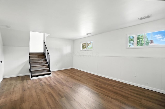 5244 Refugee Rd, Columbus, OH 43232 - basement with stairs, plenty of natural light, and wood finished floors