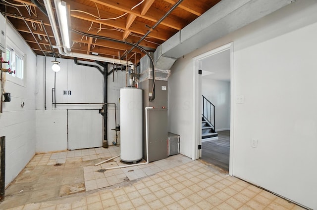 5244 Refugee Rd, Columbus, OH 43232 - below grade area featuring water heater, stairway, heating unit, and tile patterned floors