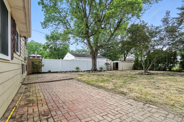 5244 Refugee Rd, Columbus, OH 43232 - fenced backyard featuring a patio area and a shed