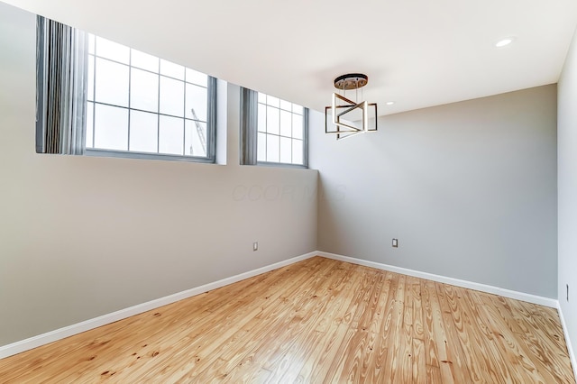 444 N Front St Unit 312, Columbus, OH 43215 - spare room featuring a chandelier, wood finished floors, and recessed lighting