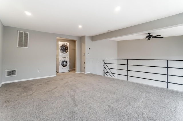 444 N Front St Unit 312, Columbus, OH 43215 - carpeted empty room with estacked washer and dryer, ceiling fan, and recessed lighting