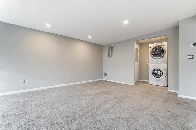444 N Front St Unit 312, Columbus, OH 43215 - unfurnished living room with stacked washer / drying machine, carpet, and recessed lighting