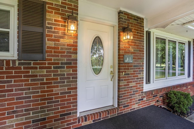 3251 Old Mill Rd NE, Lancaster, OH 43130 - view of exterior entry with brick siding and a porch
