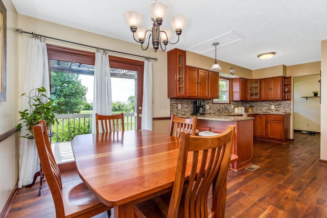 3251 Old Mill Rd NE, Lancaster, OH 43130 - dining room featuring dark wood finished floors and a chandelier