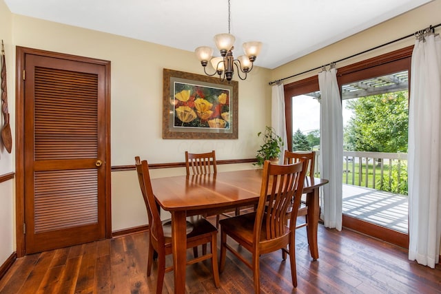 3251 Old Mill Rd NE, Lancaster, OH 43130 - dining room featuring a chandelier and dark wood-style floors