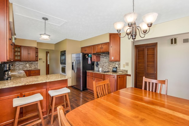 3251 Old Mill Rd NE, Lancaster, OH 43130 - kitchen with stainless steel refrigerator with ice dispenser, backsplash, dark wood finished floors, and a chandelier