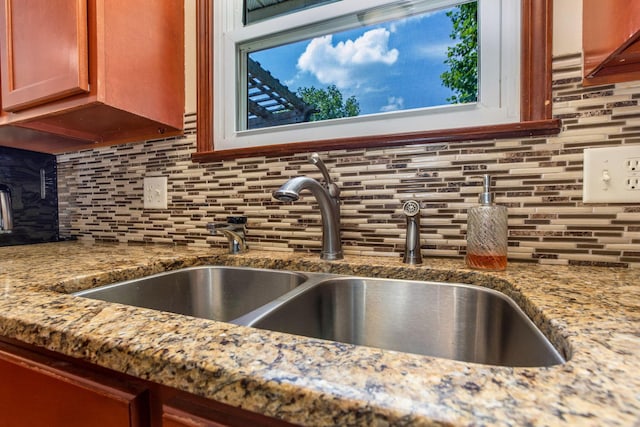 3251 Old Mill Rd NE, Lancaster, OH 43130 - kitchen view of decorative backsplash, light stone countertops, dishwasher, and a fireplace