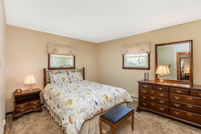 3251 Old Mill Rd NE, Lancaster, OH 43130 - bedroom with light carpet, multiple windows, and a baseboard heating unit