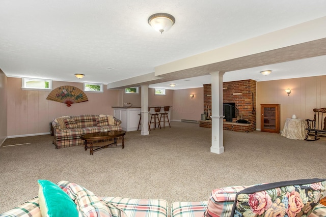 3251 Old Mill Rd NE, Lancaster, OH 43130 - carpeted living room featuring a brick fireplace, wood walls, and bar area