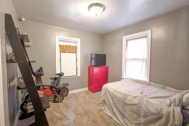 261 Superior St, Mansfield, OH 44902 - carpeted bedroom featuring a textured wall and baseboards