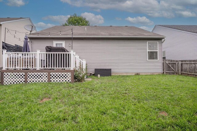 2621 Edencreek Ln, Columbus, OH 43207 - rear view of house featuring a wooden deck and roof with shingles