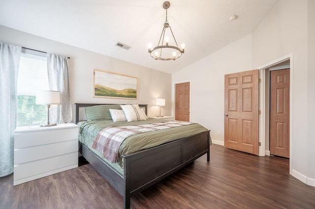 2621 Edencreek Ln, Columbus, OH 43207 - bedroom with a chandelier, wood finished floors, and vaulted ceiling