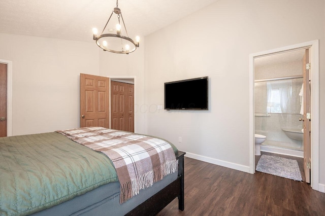 2621 Edencreek Ln, Columbus, OH 43207 - bedroom featuring a chandelier, dark wood-style flooring, a closet, and ensuite bath