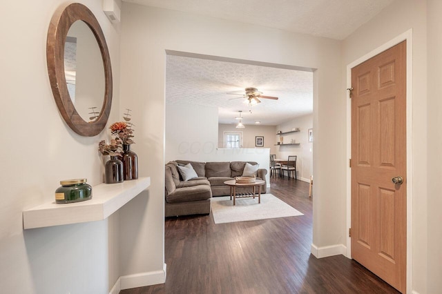 2621 Edencreek Ln, Columbus, OH 43207 - living room with a textured ceiling, ceiling fan, and dark wood-style flooring