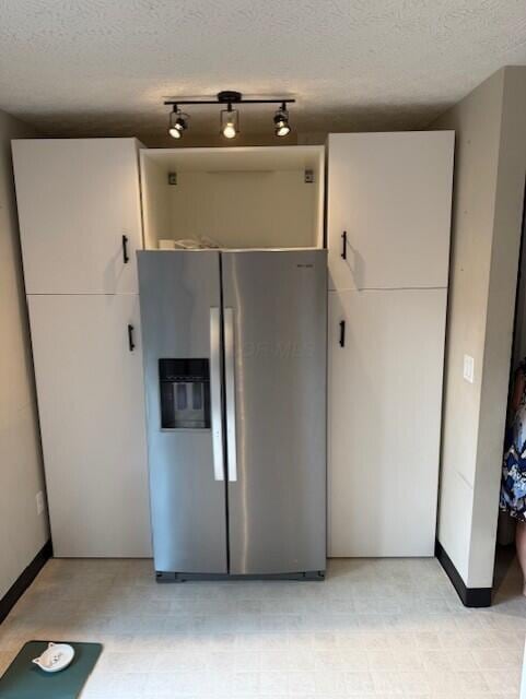 796 Cap Ln Unit 21C, Columbus, OH 43085 - kitchen featuring stainless steel fridge, a textured ceiling, and light flooring