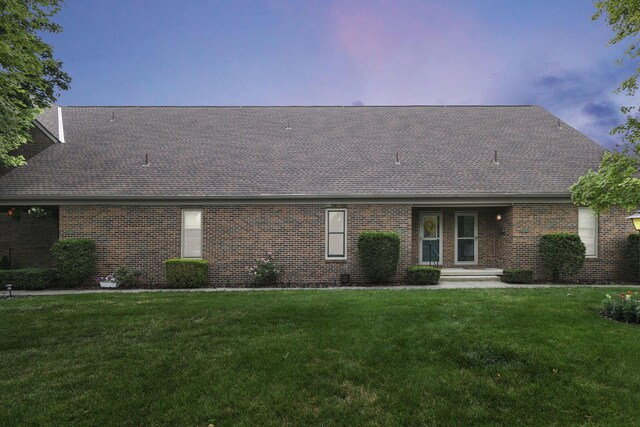1533 Sandringham Ct, Columbus, OH 43220 - view of front of property with roof with shingles, brick siding, and a front yard