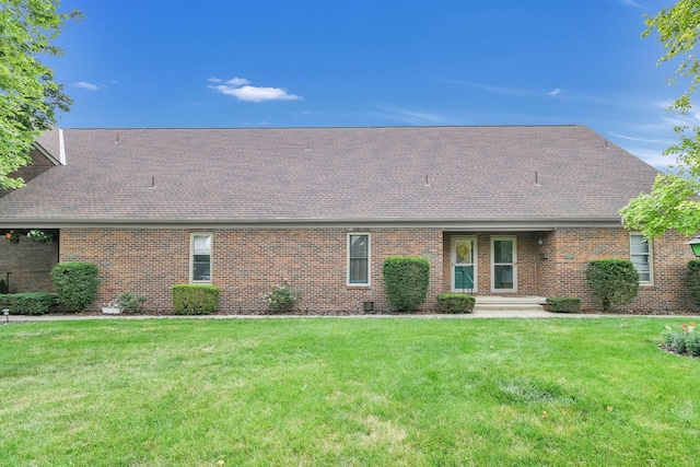 1533 Sandringham Ct, Columbus, OH 43220 - rear view of property with a shingled roof, a lawn, and brick siding
