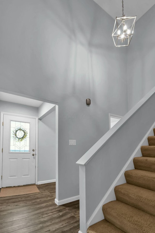 1533 Sandringham Ct, Columbus, OH 43220 - entryway with a chandelier, wood finished floors, and stairs