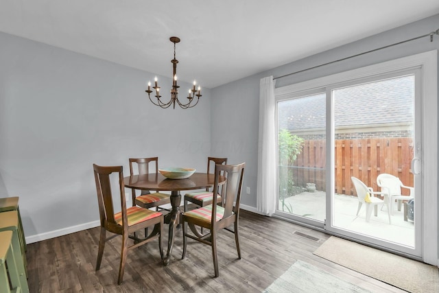 1533 Sandringham Ct, Columbus, OH 43220 - dining space featuring a chandelier and wood finished floors
