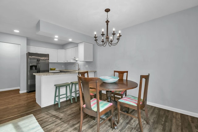 1533 Sandringham Ct, Columbus, OH 43220 - dining room with dark wood-style flooring, a chandelier, and recessed lighting