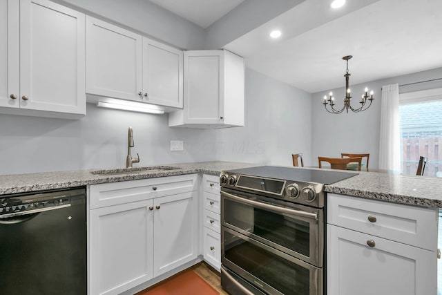 1533 Sandringham Ct, Columbus, OH 43220 - kitchen featuring double oven range, black dishwasher, a peninsula, white cabinetry, and recessed lighting