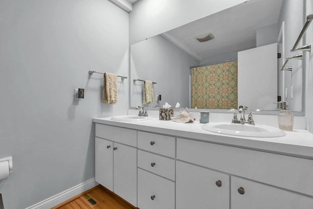 1533 Sandringham Ct, Columbus, OH 43220 - full bathroom with double vanity and wood finished floors
