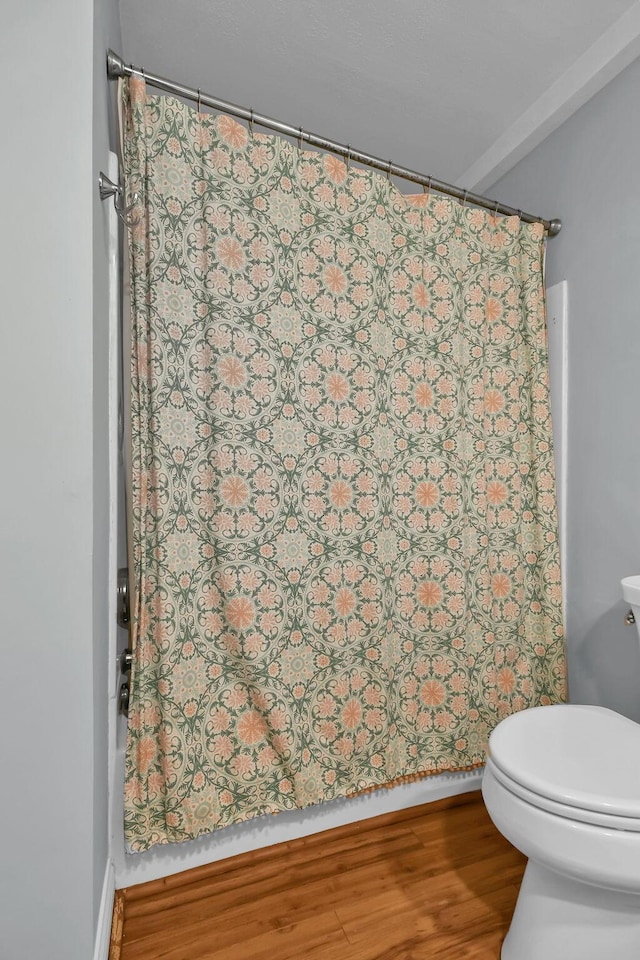1533 Sandringham Ct, Columbus, OH 43220 - bathroom featuring a shower with shower curtain and wood finished floors