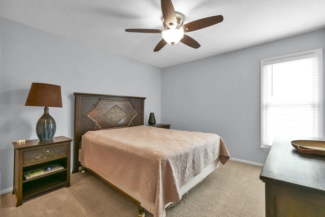 1533 Sandringham Ct, Columbus, OH 43220 - bedroom with light colored carpet, multiple windows, and ceiling fan