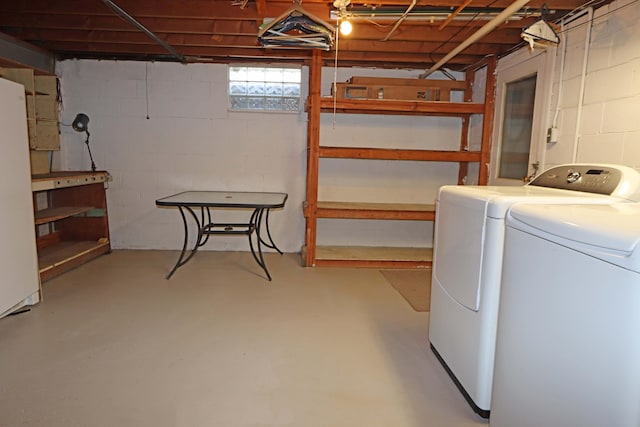 5278 Edgeview Rd, Columbus, OH 43207 - below grade area with washing machine and clothes dryer and concrete block wall