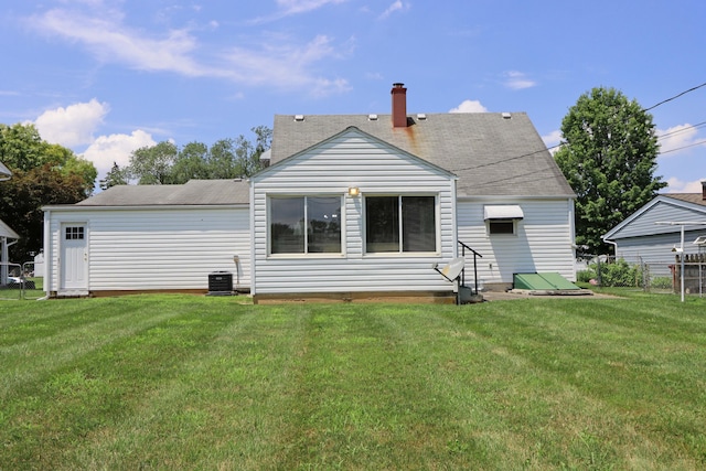 5278 Edgeview Rd, Columbus, OH 43207 - back of house featuring entry steps, a chimney, and roof with shingles