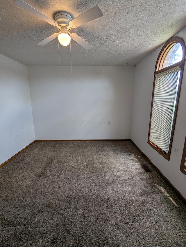 5813 Thada Ln, Columbus, OH 43229 - carpeted spare room with a textured ceiling and ceiling fan
