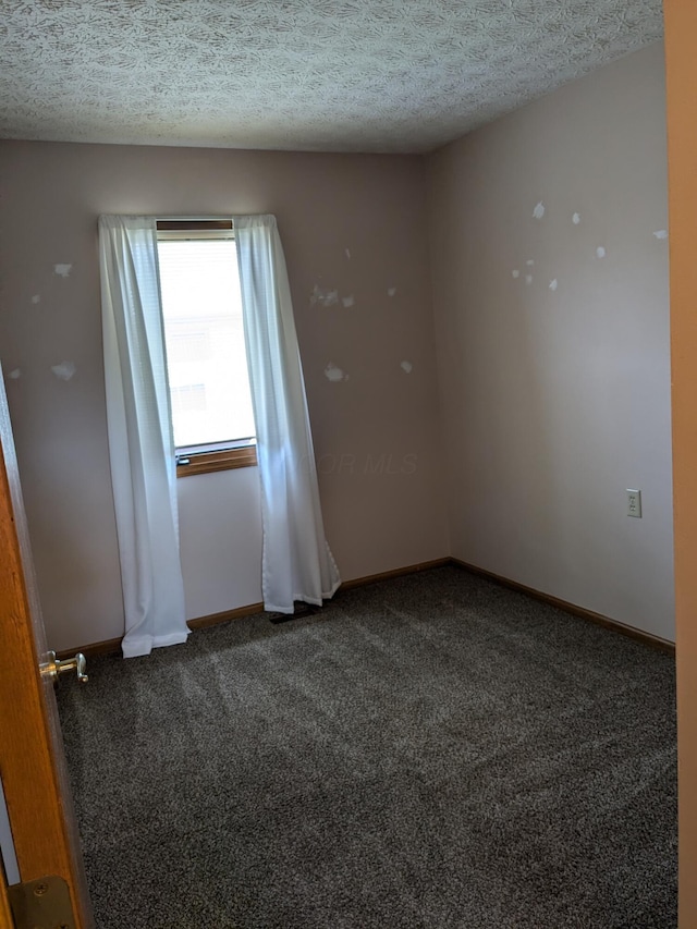 5813 Thada Ln, Columbus, OH 43229 - unfurnished room with carpet floors and a textured ceiling