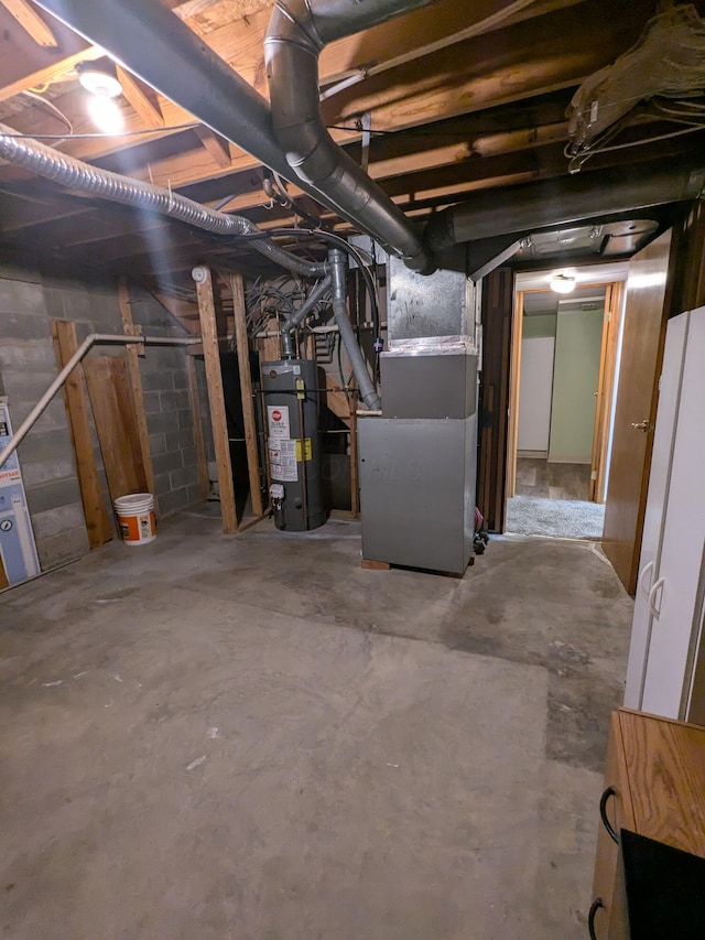 5813 Thada Ln, Columbus, OH 43229 - unfinished below grade area featuring water heater and heating unit