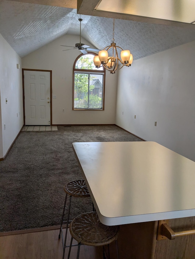 5813 Thada Ln, Columbus, OH 43229 - unfurnished dining area with lofted ceiling, a chandelier, a textured ceiling, a ceiling fan, and carpet floors