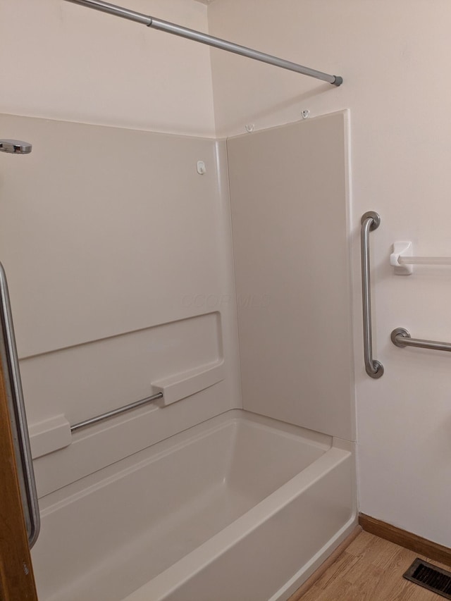 5813 Thada Ln, Columbus, OH 43229 - full bathroom with wood finished floors and shower / washtub combination