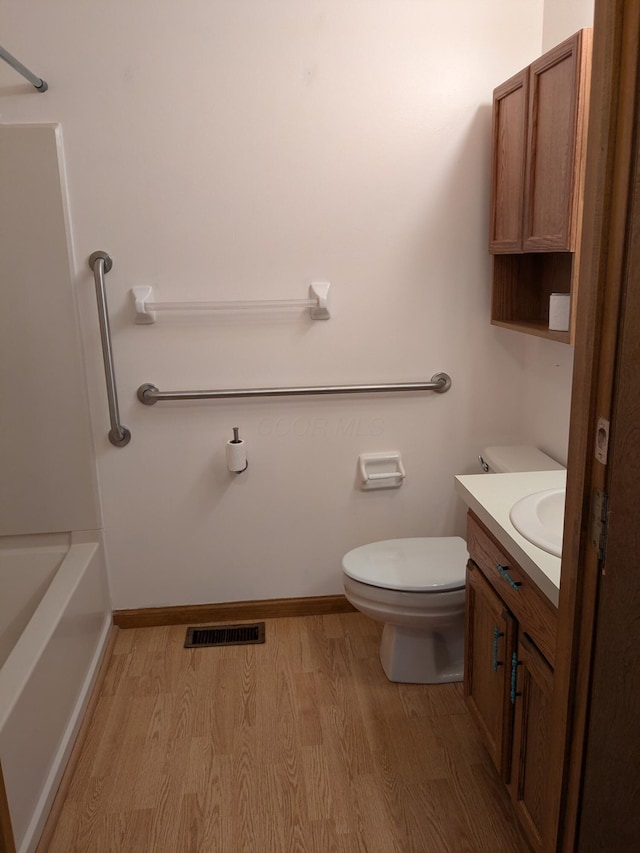 5813 Thada Ln, Columbus, OH 43229 - bathroom featuring wood finished floors, a tub, vanity, and a shower