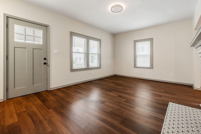 139 S Princeton Ave, Columbus, OH 43222 - entryway featuring plenty of natural light, wood-type flooring, and a fireplace