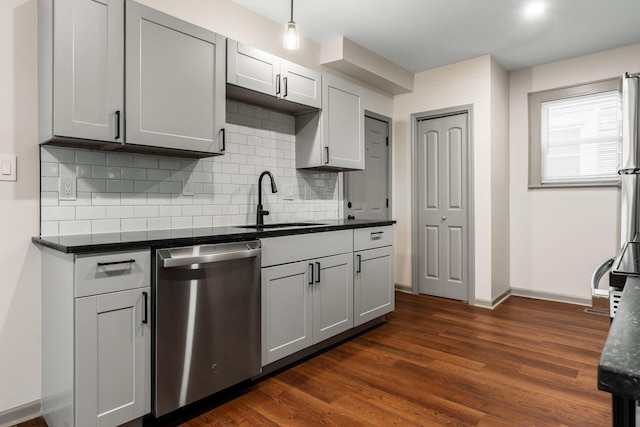 139 S Princeton Ave, Columbus, OH 43222 - kitchen with stainless steel dishwasher, dark wood-type flooring, backsplash, and decorative light fixtures